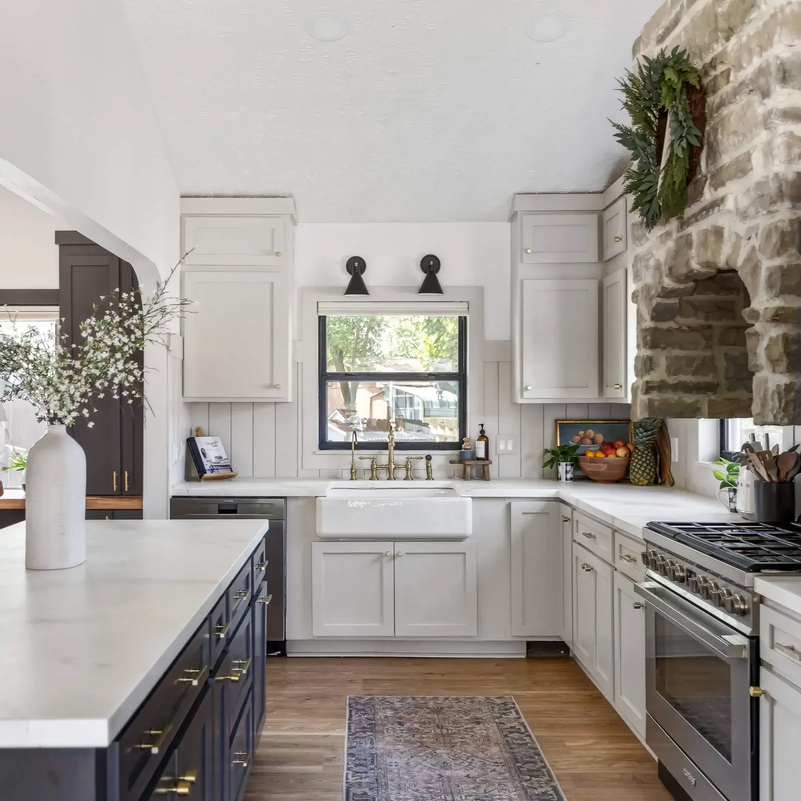 Luxury kitchen remodeling in Metairie, LA featuring custom white cabinetry and quartz countertops.